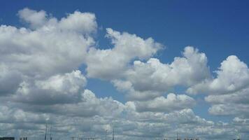 The beautiful sky view with the white clouds and blue sky as background in summer photo