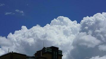 The beautiful sky view with the white clouds and blue sky as background in summer photo