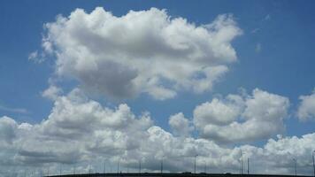 The beautiful sky view with the white clouds and blue sky as background in summer photo