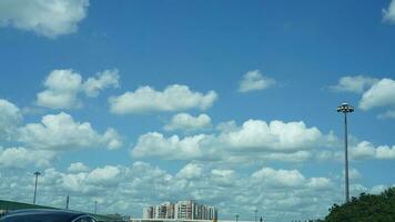 The beautiful sky view with the white clouds and blue sky as background in summer photo