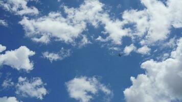 The beautiful sky view with the white clouds and blue sky as background in summer photo
