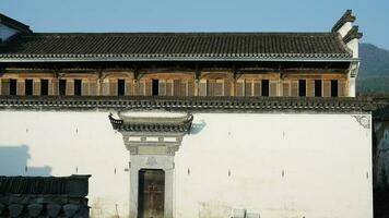 The beautiful traditional Chinese village view with the classical architecture and narrow lane  as background photo