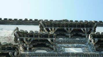 The old Chinese house carved with the beautiful stone sculptures in the countryside village of the China photo