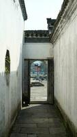 The beautiful traditional Chinese village view with the classical architecture and narrow lane  as background photo