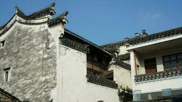 The beautiful traditional Chinese village view with the classical architecture and narrow lane  as background photo