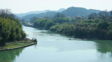 The mountains and valley view with the river running through them in spring photo