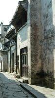 The beautiful traditional Chinese village view with the classical architecture and narrow lane  as background photo