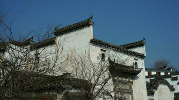 The beautiful traditional Chinese village view with the classical architecture and narrow lane  as background photo