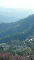 The beautiful mountains view from the top of the hill in spring photo