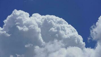 The beautiful sky view with the white clouds and blue sky as background in summer photo