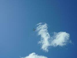 The beautiful sky view with the white clouds and blue sky as background in summer photo