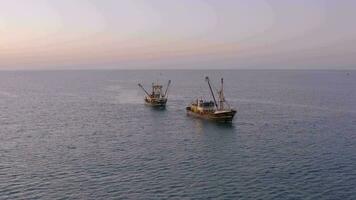 Fishing Trawlers at Sea in the Early Morning Aerial View video