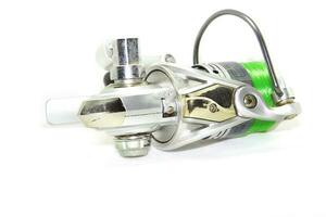 Fishing reels is a leisure sport or hobby of the unemployed, fishing is a popular thing for people to fish to eat and is a sport on a white background. photo