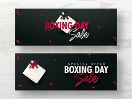 Advertising header or banner set with gift box on black background for Boxing Day Sale. vector