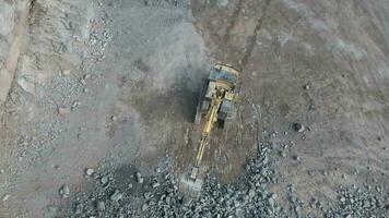 Digger Working on Blasted Rocks in a Quarry video