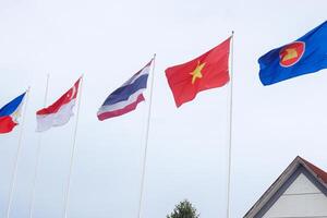 The flags of Association of Southeast Asian Nations the clear blue sky. photo