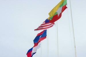 The flags of Association of Southeast Asian Nations the clear blue sky. photo