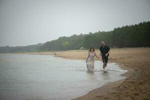 Romantic young couple in love on the beach photo