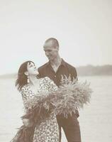 Romantic young couple in love on the beach photo