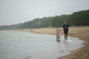 Romantic young couple in love on the beach photo