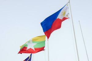 The flags of Association of Southeast Asian Nations the clear blue sky. photo