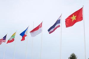 The flags of Association of Southeast Asian Nations the clear blue sky. photo