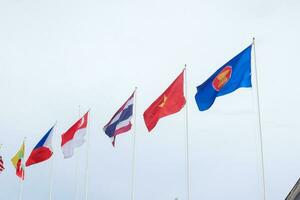 The flags of Association of Southeast Asian Nations the clear blue sky. photo