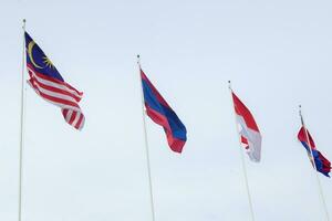 The flags of Association of Southeast Asian Nations the clear blue sky. photo