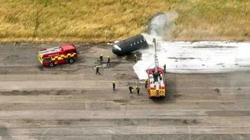 Firefighters Training to Tackle a Fire of a Dummy Aircraft video