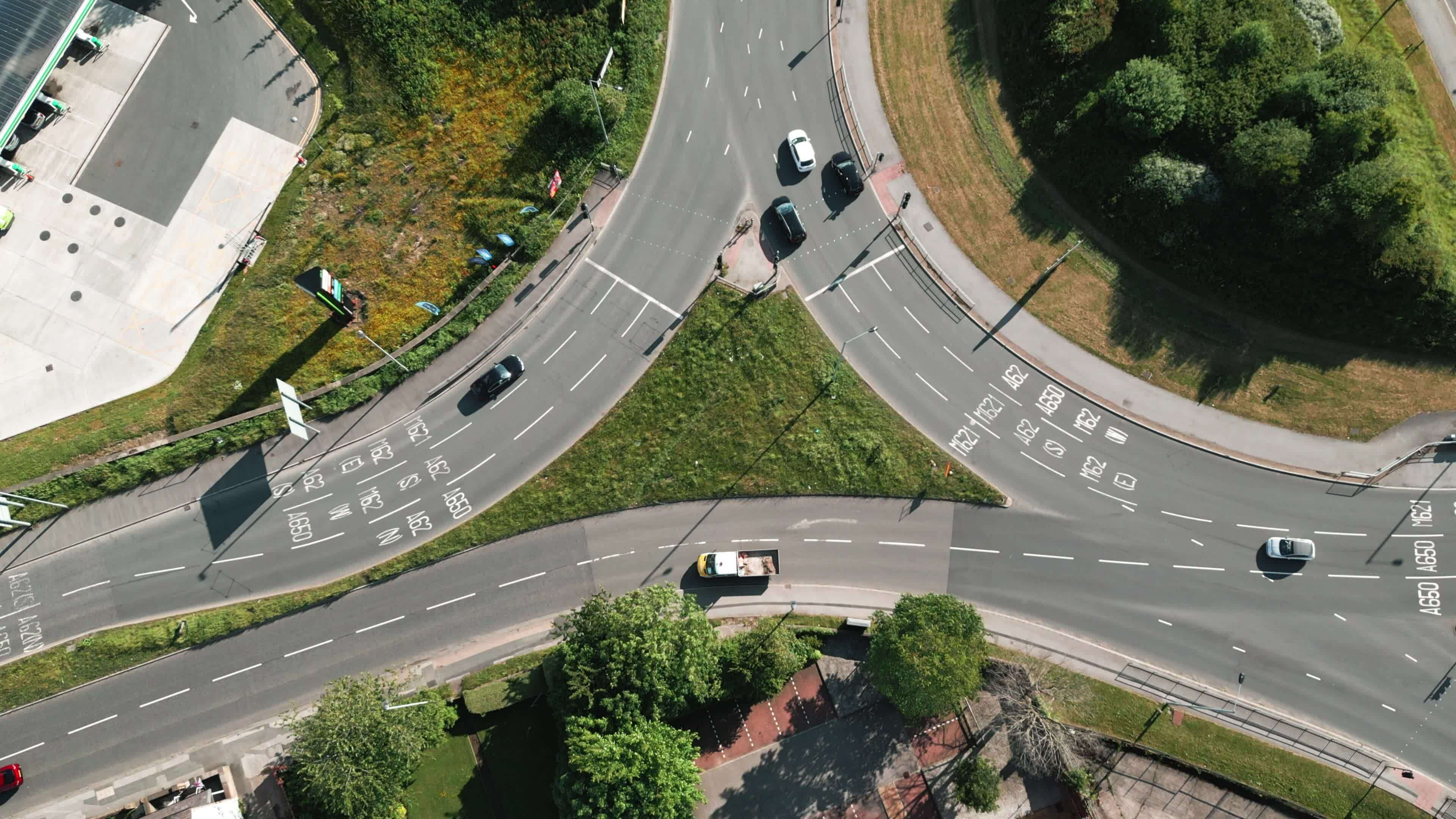 Vehicles Stopping at a Traffic Light Controlled Roundabout System 23442556 Stock Video at Vecteezy