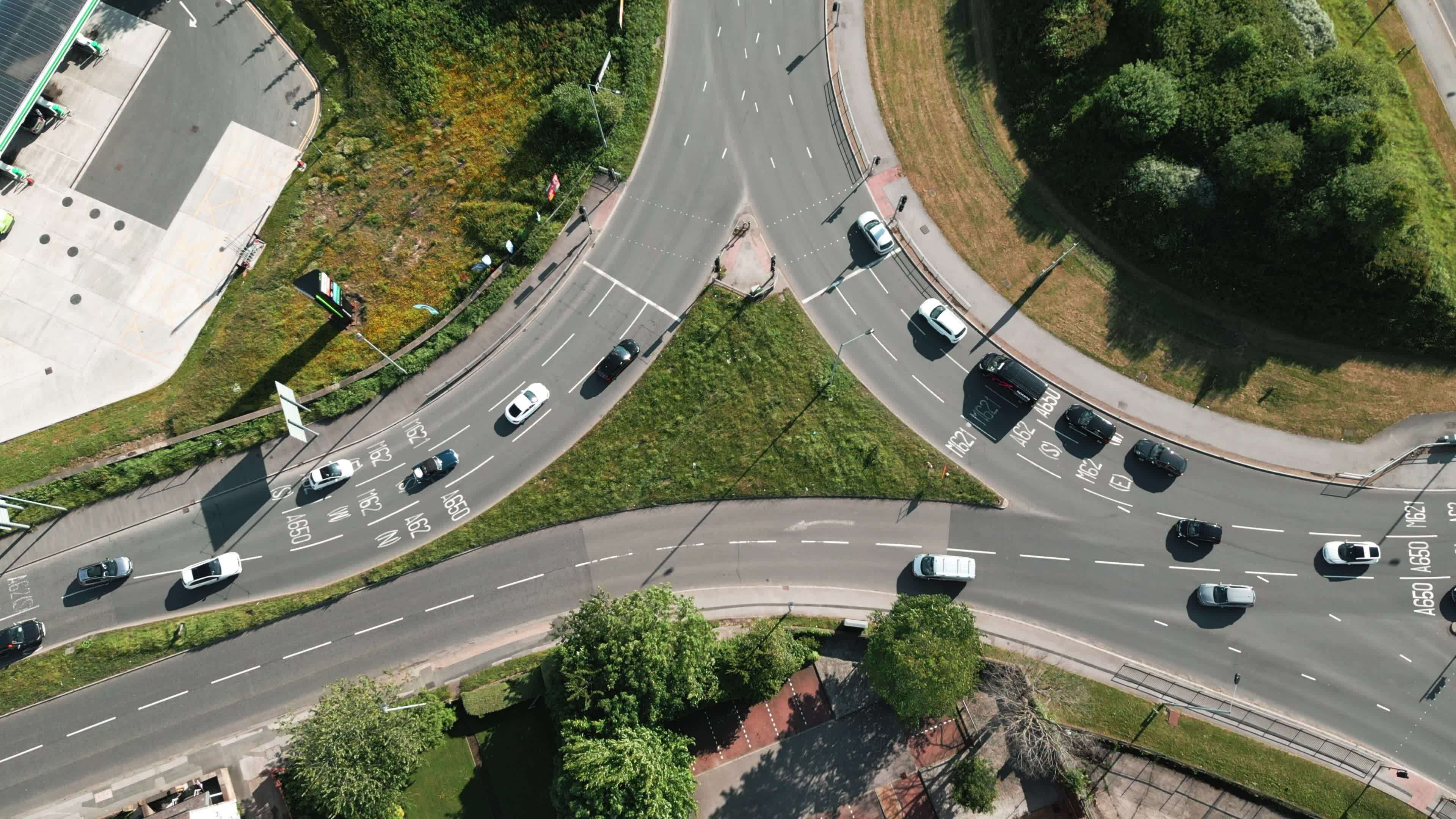 Vehicles Stopping at a Traffic Light Controlled Roundabout System 23442557 Stock Video at Vecteezy