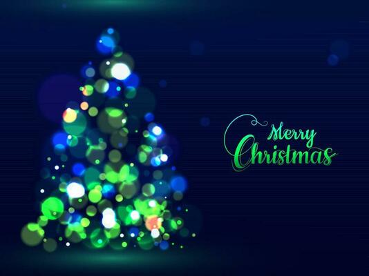 Green calligraphy text Merry Christmas and creative Xmas tree made by bokeh effect on blue background can be used as greeting card design.
