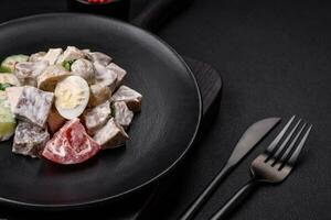Delicious salad with boiled beef tongue, quail eggs, tomatoes and cucumber photo