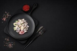 Delicious salad with boiled beef tongue, quail eggs, tomatoes and cucumber photo