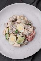 Delicious salad with boiled beef tongue, quail eggs, tomatoes and cucumber photo