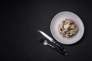 Delicious salad with boiled beef tongue, quail eggs, tomatoes and cucumber photo