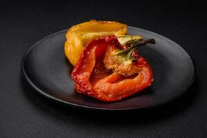 Delicious juicy grilled peppers with spices and herbs photo