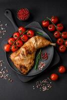 Fresh grilled chicken leg with salt, spices and herbs photo