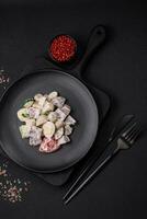 Delicious salad with boiled beef tongue, quail eggs, tomatoes and cucumber photo
