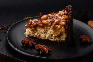 Delicious fresh cheesecake cake or snickers with cream and nuts photo