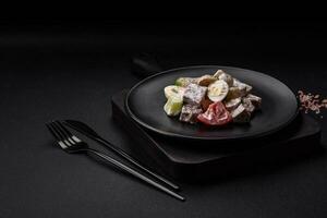 Delicious salad with boiled beef tongue, quail eggs, tomatoes and cucumber photo