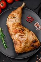 Fresh grilled chicken leg with salt, spices and herbs photo