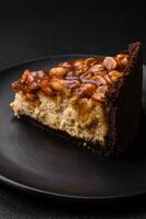 Delicious fresh cheesecake cake or snickers with cream and nuts photo