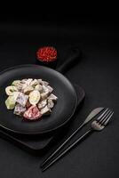 Delicious salad with boiled beef tongue, quail eggs, tomatoes and cucumber photo