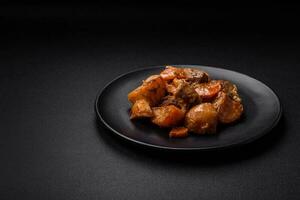 Delicious fresh cooked stew with pork meat or beef with potatoes, carrots, spices and herbs photo