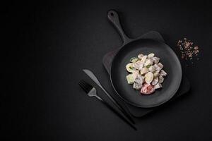 Delicious salad with boiled beef tongue, quail eggs, tomatoes and cucumber photo