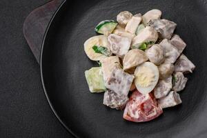 Delicious salad with boiled beef tongue, quail eggs, tomatoes and cucumber photo