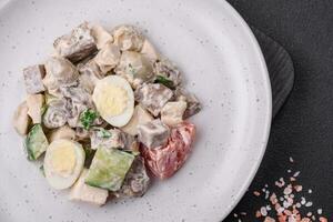 Delicious salad with boiled beef tongue, quail eggs, tomatoes and cucumber photo