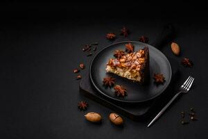 Delicious fresh cheesecake cake or snickers with cream and nuts photo