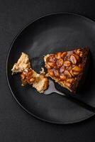 Delicious fresh cheesecake cake or snickers with cream and nuts photo